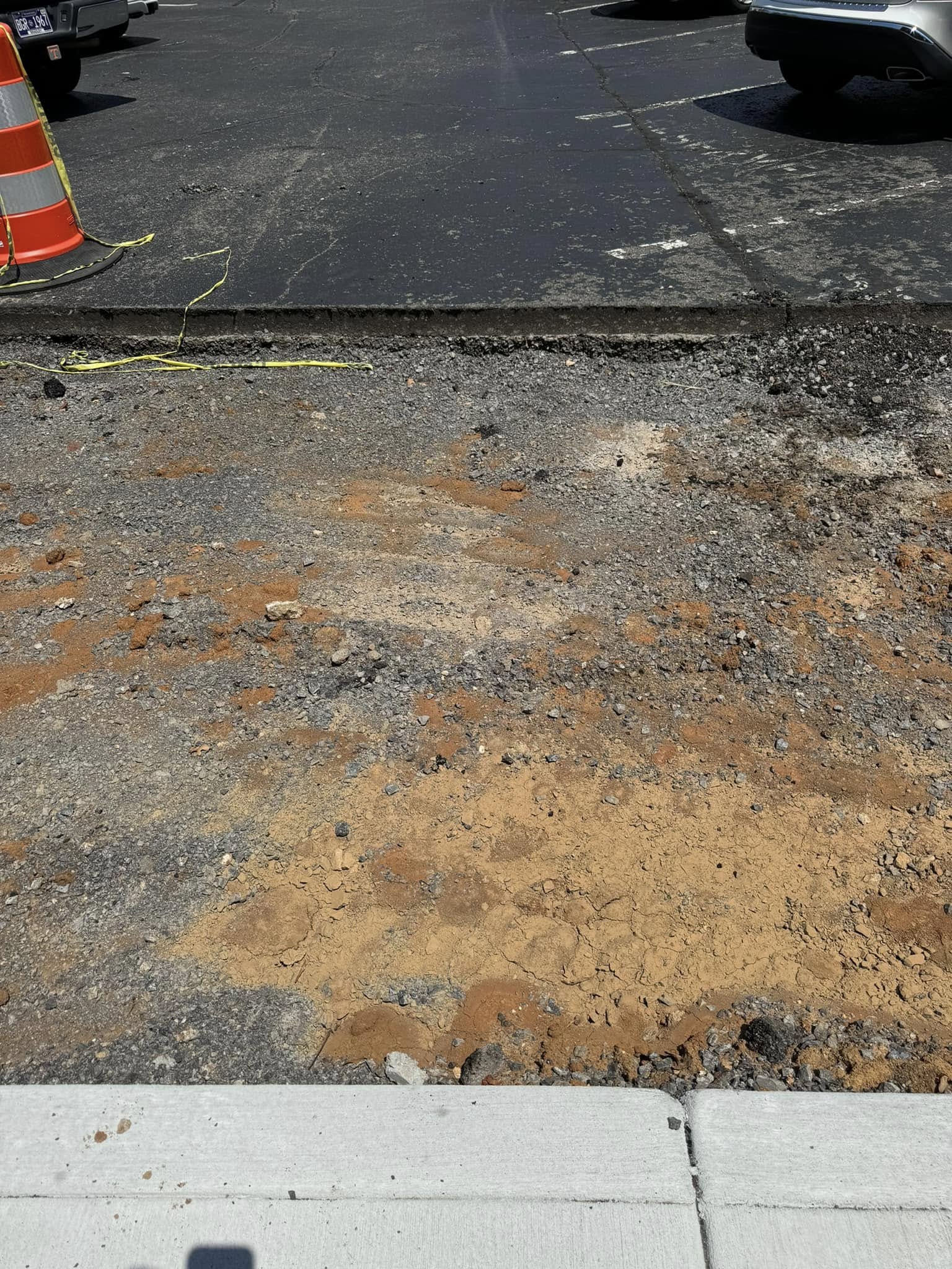 Damaged asphalt before repair